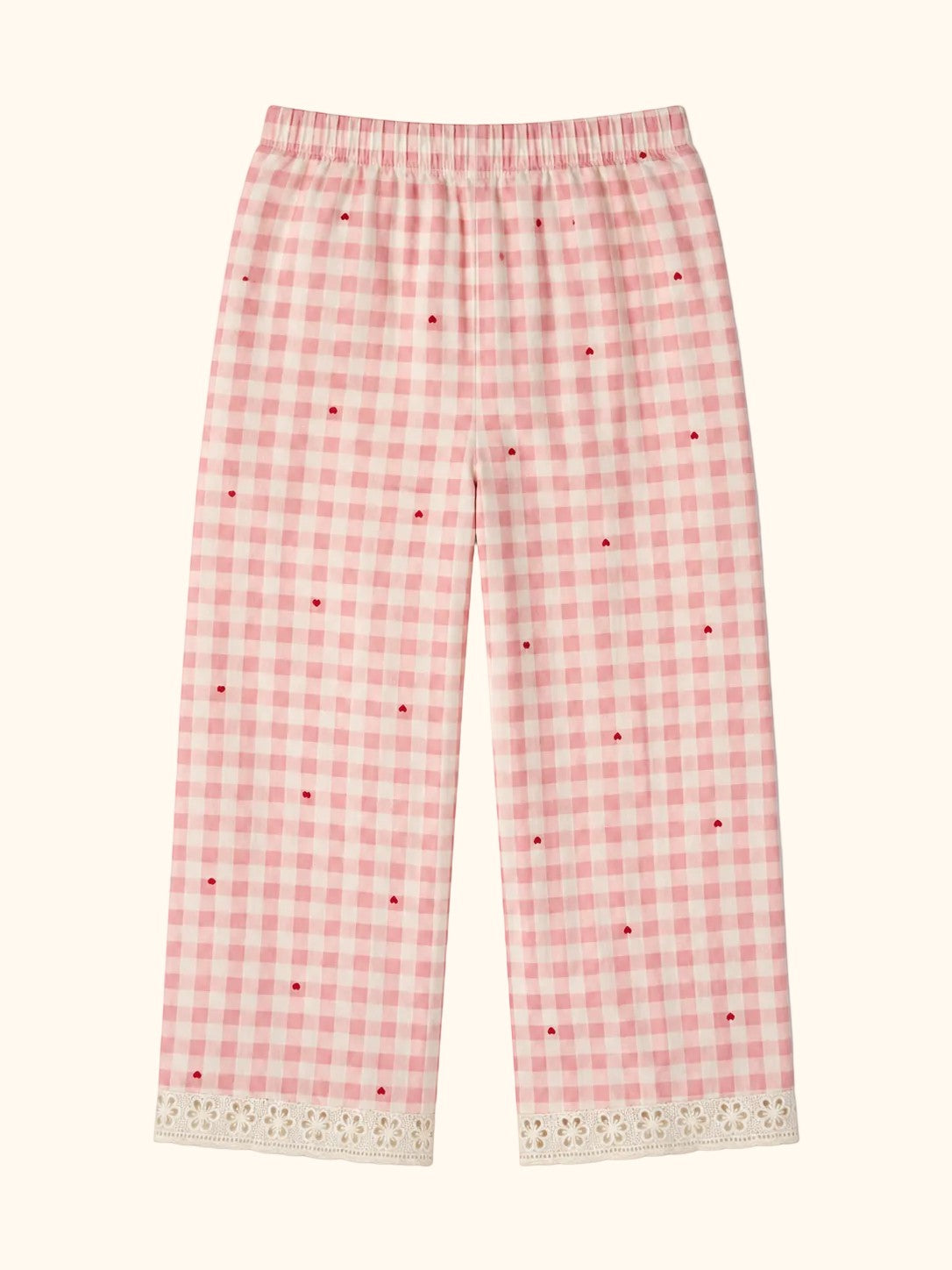 Cocolooms pink and white gingham trousers with red heart embroidery and white eyelet lace trim on the cuffs.