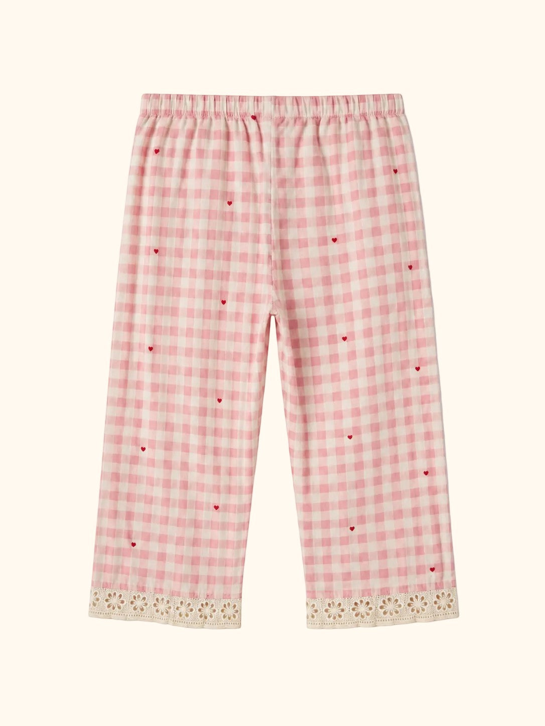 Cocolooms pink and white gingham trousers with tiny red heart embroidery and ivory eyelet lace trim on the cuffs.